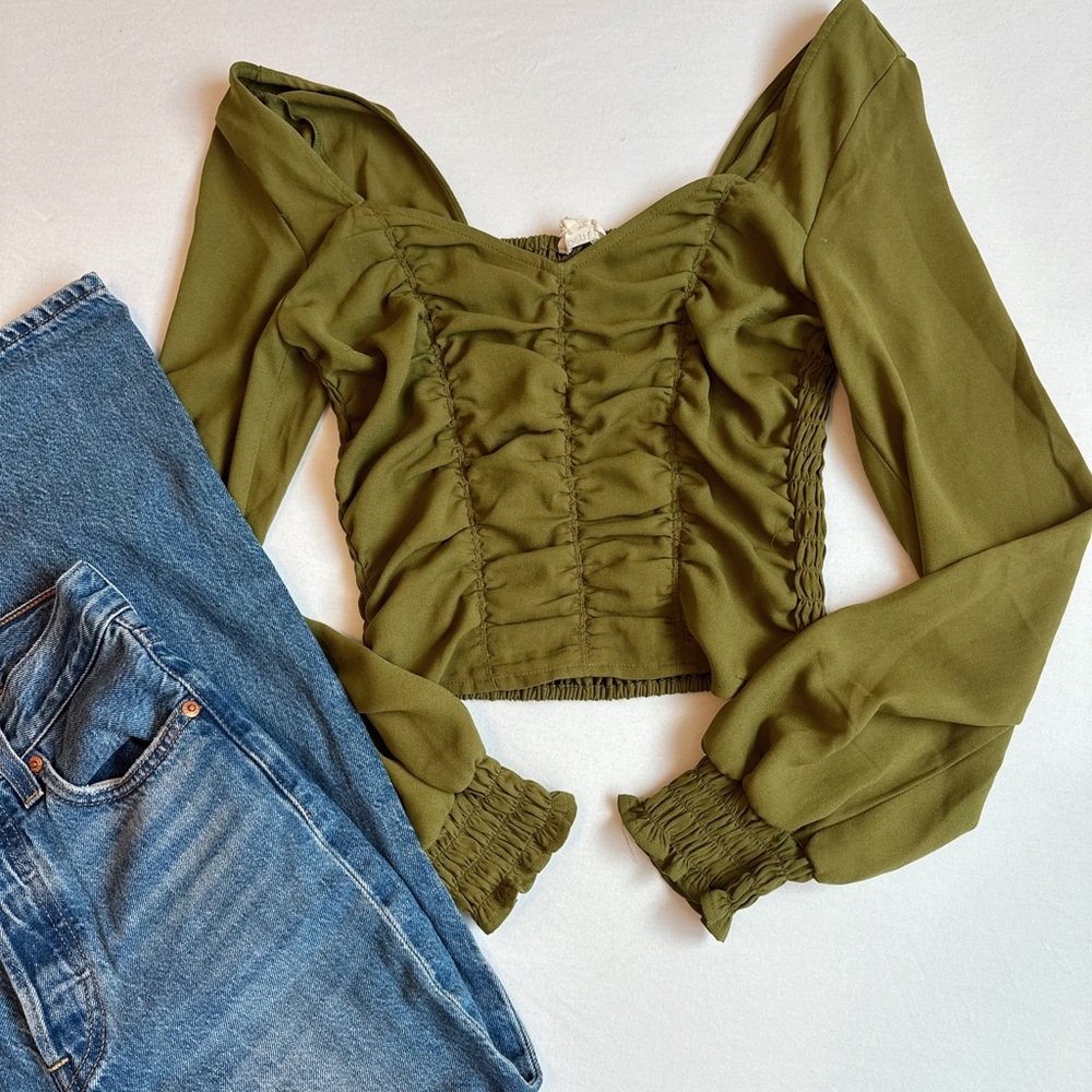 Green smocked blouse